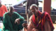 Some of the village elders experimenting with one of the project cameras.