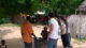 After speaking with the elders, we toured the nearby villages. Issa and Jeremy met the locals while the school director, in orange, gathered up the students we’d be working with.
